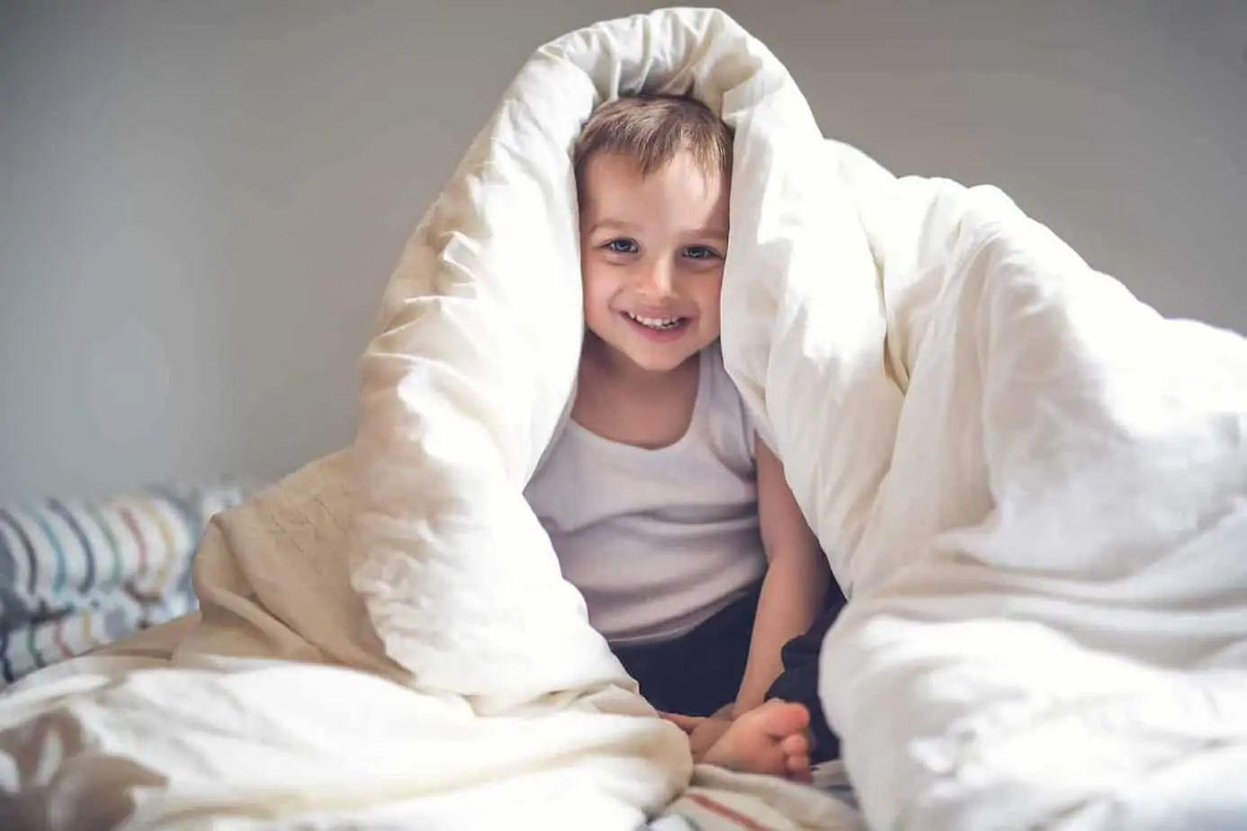 9 tried-and-true strategies to make bedtime easier with kids. Bedtime for kids doesn't have to be stressful. Help your kids go to bed without a battle. 9 Ways to Make bedtime easier.