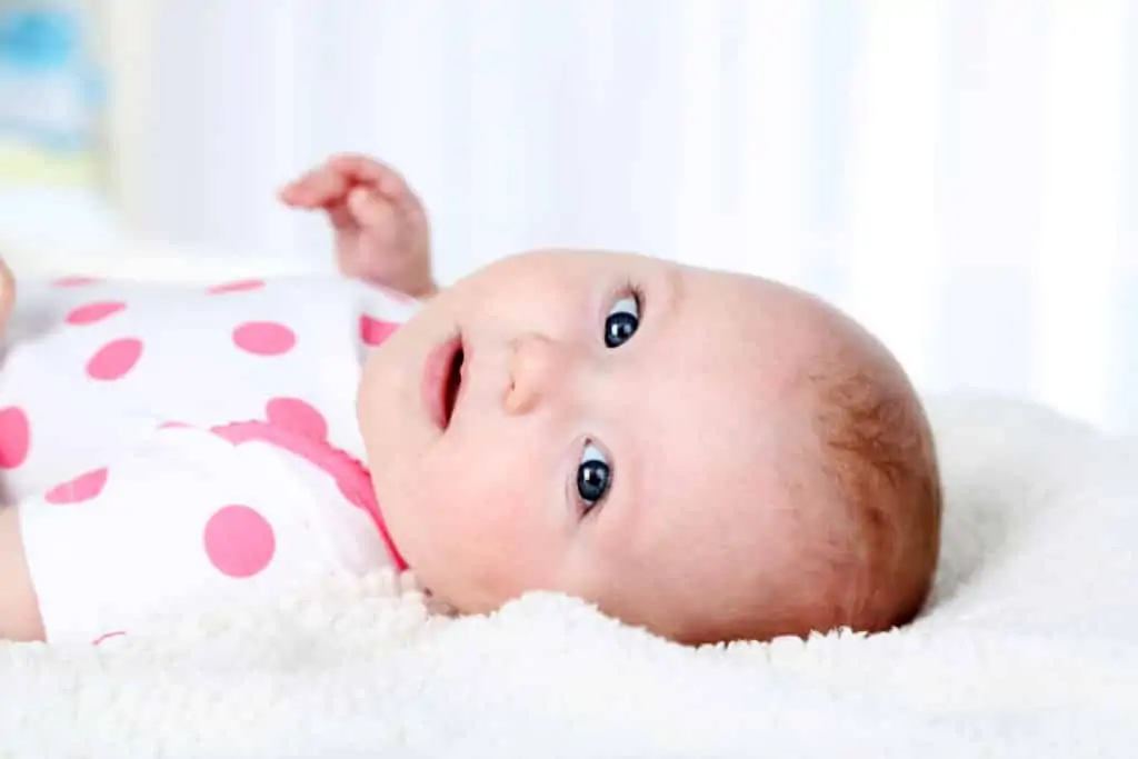 Signs Your Baby is Ready to Drop a Nap. How to tell and what to do when baby is dropping a nap. Handling nap transitions and adjusting your daily routine for one less nap a day. Do you drop the afternoon nap or the morning nap first? Learn when common nap transitions occur, and how to handle these nap challenges.