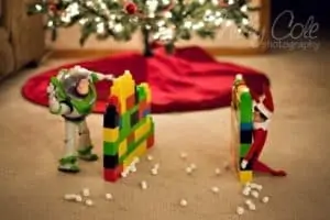 snowball fight with a toy and elf on the shelf